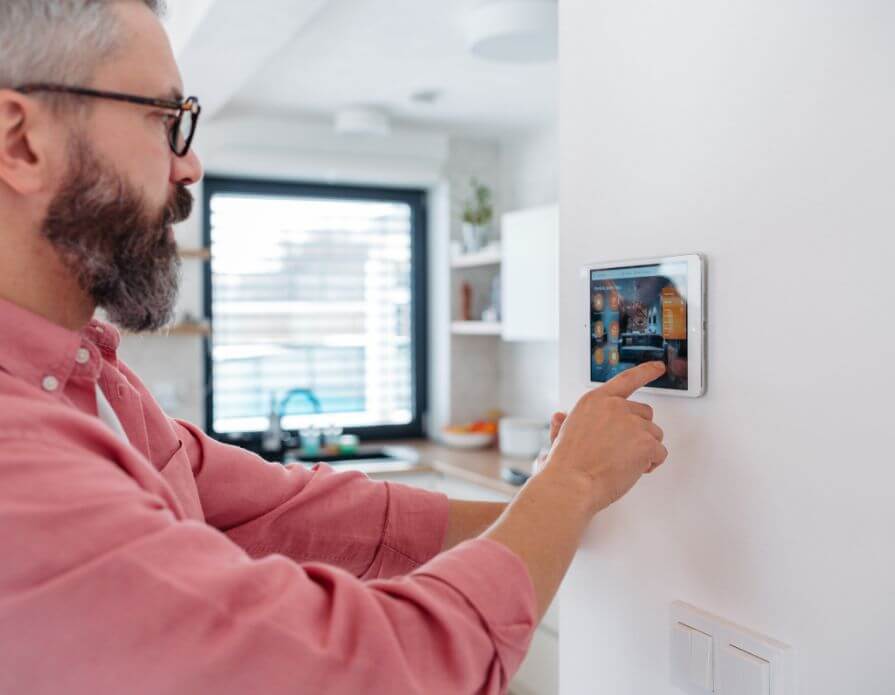 Mobilehomeoutfitters 359599 Man Using Smart Thermostat Image1